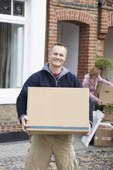 Moving van and boxed household items for a home move in Holland Park