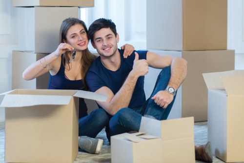Removal team preparing furniture for a move in Holland Park