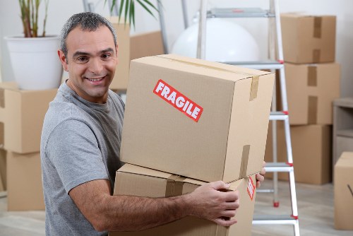 Man with van service helping with a residential move in Holland Park