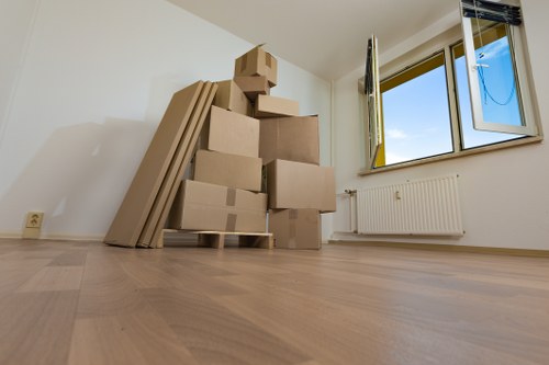 Packed boxes and furniture ready for a moving van in Holland Park
