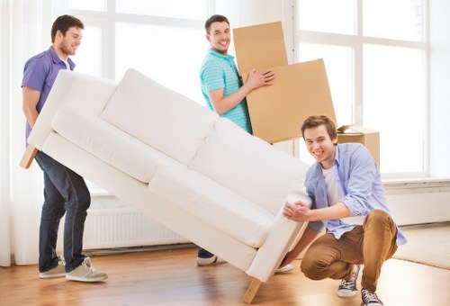 Removal crew carefully handling furniture during a home move