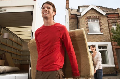 Removal team preparing a move in Holland Park near period homes
