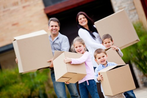 Prepared moving boxes and furniture in a Holland Park property