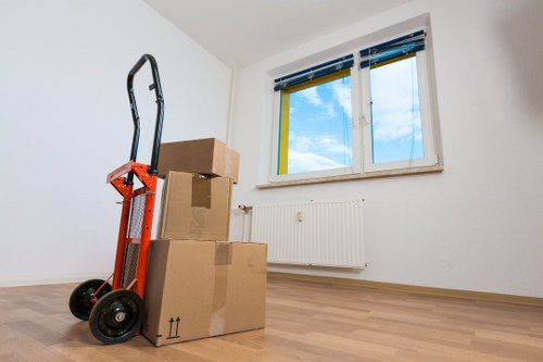 Furniture and boxes being loaded for a Holland Park move