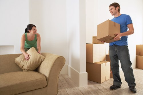 Furniture and boxes being prepared for a man with van move in Holland Park